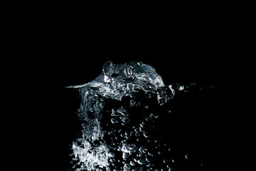 water waves with beautiful bubbles on a black background.
