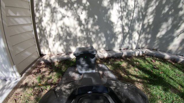 Point of view of robotic lawn mower docking itself into charging station.