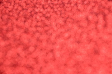 Beautiful festive red background with blurred sequins