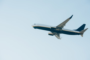 Fototapeta na wymiar Low angle view of aeroplane with blue sky at background