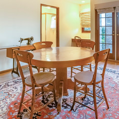 Square frame Bonus room with table and other amenities with large rug