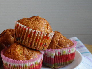 muffins with raisins on a gray background