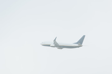 Low angle view of jet plane with cloudy sky at background