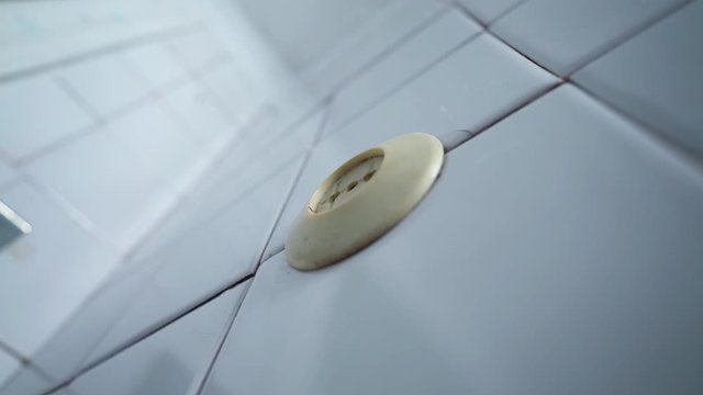 Old socket on the wall. Short circuit. Old power grid. Voltage drop in the room. The light is blinking. Danger. Lighting turn on and off. Power source. House of Horror.	
