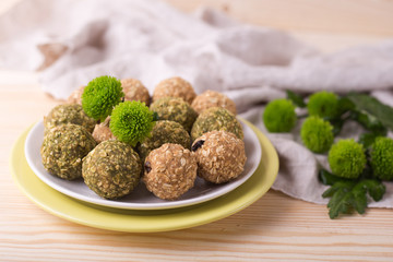 Healthy organic energy granola bites with nuts, raisins, matcha and honey - vegan vegetarian raw snack or meal