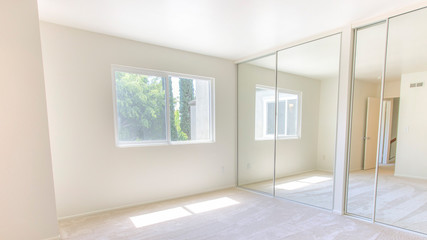 Fototapeta na wymiar Panorama frame Master bedroom with double closet doors