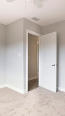 Fototapeta na wymiar Vertical Empty bedroom with door open clean inside