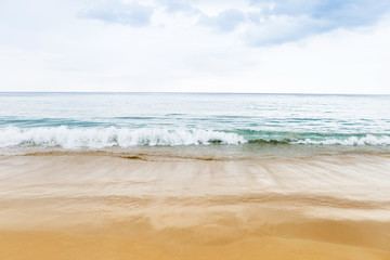 White wave on the beach in cloudy day in South of Thailand, monsoon season, outdoor day light, nature and weather concept