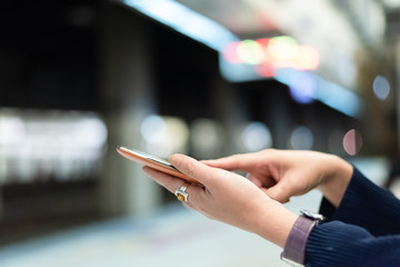 using cellphone in the rail station