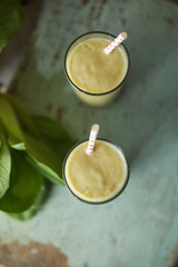 Healthy green smoothie and ingredients..