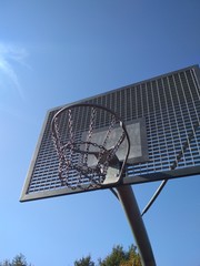 basketball hoop on classic blue sky background.