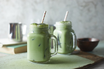 Homemade iced matcha latte tea with milk..