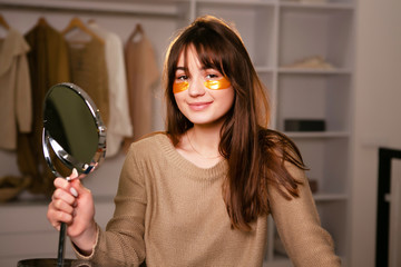 Young attractive woman with mask under eyes looking