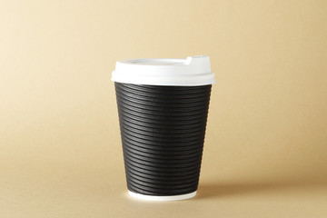 Paper cups of coffee on table on color background. Mockup design. Place for text. A place for the logo.