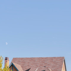 Square frame Steeply pitched house roof with dormer windows