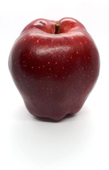 close-up of fruit, fresh ripe uncooked flavorful sweet red apple isolated on a white background