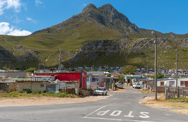 .Kleinmond, Western Cape, South Africa. December 2019. Entrance to a township at Kleinmond on the garden route, South Africa. - obrazy, fototapety, plakaty