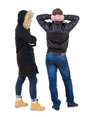 Back view of couple in winter jacket.