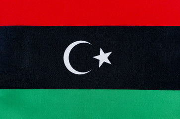 Flag of the state of Libya on a textile basis close up