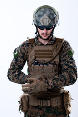 closeup of soldier hands putting protective battle gloves