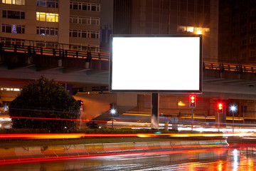 Blank billboard on night street