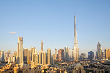 Fototapeta na wymiar Dubai city skyline with Burj Khalifa skyscraper in a sunny day, blue sky