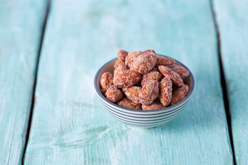 sugared almonds on a wooden surface