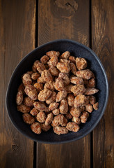 sugared almonds on a wooden surface