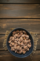 sugared almonds on a wooden surface