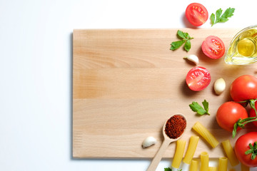 Clean healthy eating habits concept. Uncooked pasta, greens & vegetables mix and other vegan macaroni ingredients, white background. Vegetarian diet food. Flat lay, copy space
