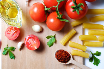 Clean healthy eating habits concept. Uncooked pasta, greens & vegetables mix and other vegan macaroni ingredients, white background. Vegetarian diet food. Flat lay, copy space