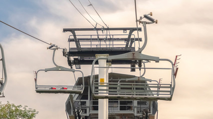 Pano frame Chairlifts and chairlift terminal on top of a mountain in Park City in summer