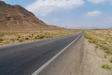 Countryside asphalt road circa Yazd, Iran.