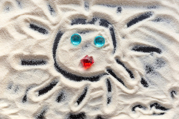 Сhild draws on the sand. Creativity with a small child. Drawing on the sand.