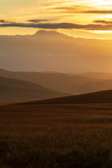 Epic sunset over Mongolian mountains in southern Mongolia.