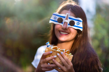 Israeli girl holding pita with falafel