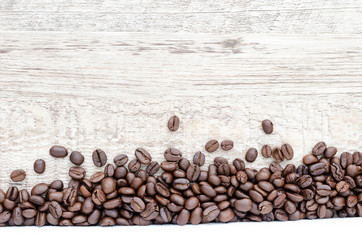 Coffee beans on wood background