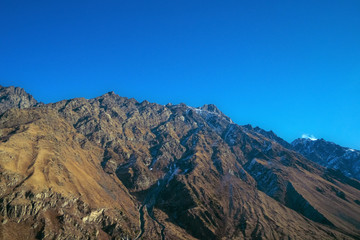 beautiful view of high powerful  mountains and blue sky