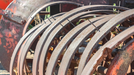 Pano Damaged and rusty wheels of an old vintage tractor on a farm on a sunny day