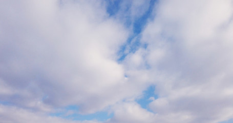 White clouds with blue sky background.