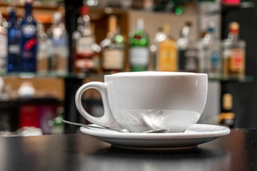 Coffee Latte in white cup in the bar