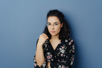 Serious young woman with an introvert expression