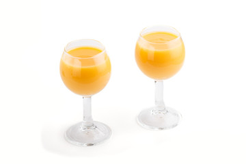 Sweet egg liqueur in glass isolated on white background. Side view