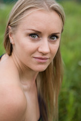 The face of a young natural blonde close-up.