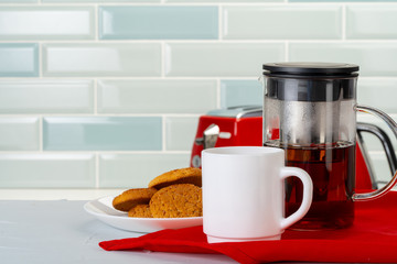 Tea served on a wooden kitchen table