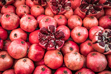 Many pomegranate cut in half, pomegranate background