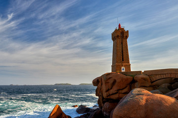 Lighthouse among the red rocks of Perros-Guirec, France