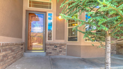Pano Home with bay window and glass paned door with sidelight and transom window