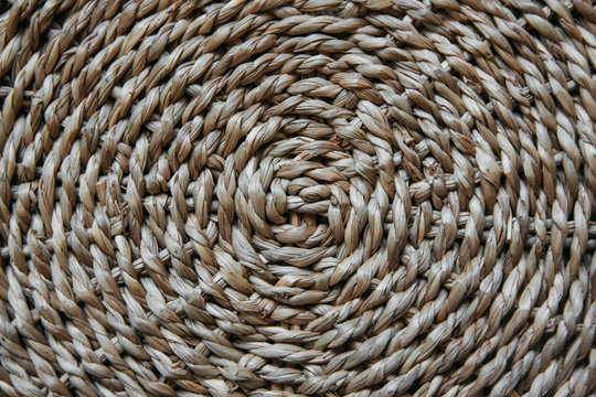 Structure and background of a wicker basket. Pattern of round texture. Close up.