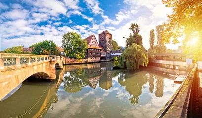 Nurnberg. Pegnitz river weaterfront Weinstadel and Henkersteg in Nuremberg sunrise view © xbrchx